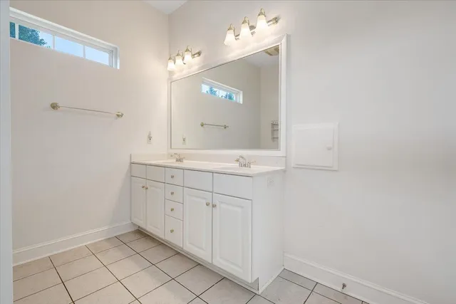 a front view of house with yard and trees