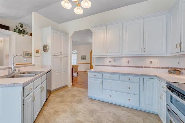 a balcony with furniture and a floor to ceiling window