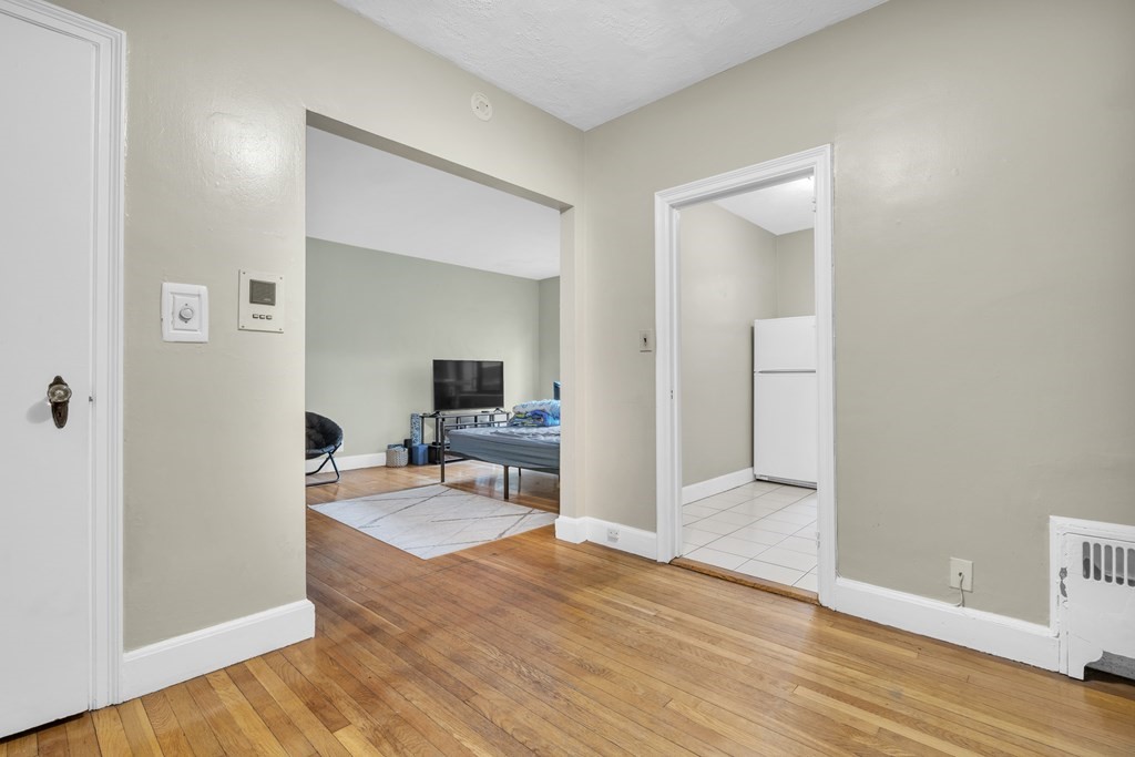 65 Strathmore Road, Unit 21 Boston, MA 02135 - Photo 6 of 10 a view of a livingroom with wooden floor and furniture