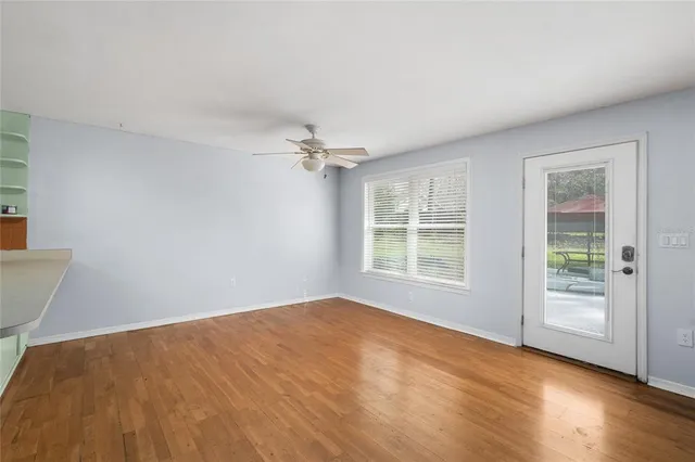 a view of an empty room with a window