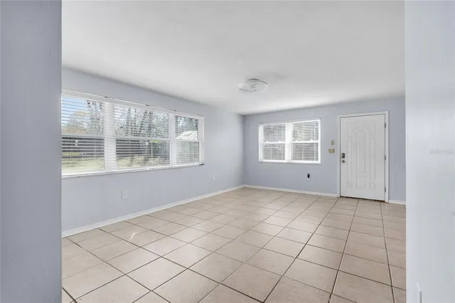 a view of an empty room with windows