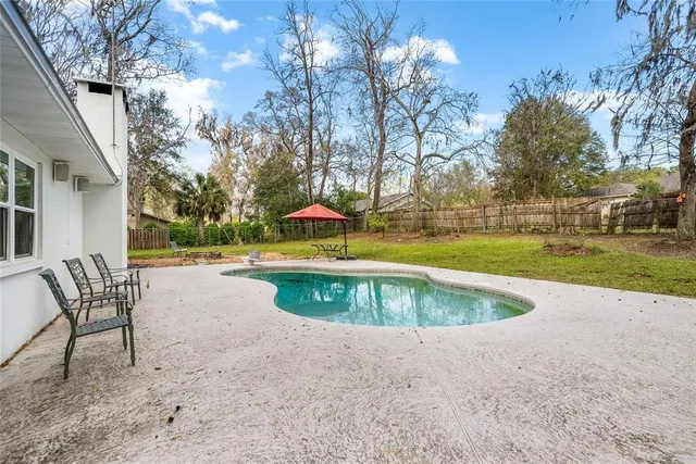 a view of a swimming pool with a lounge chairs