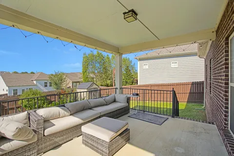 a view of a house with a big yard and potted plants
