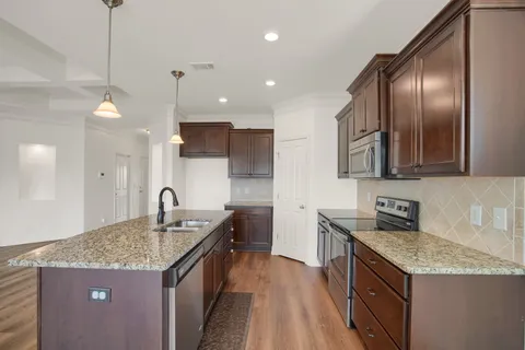 a balcony with furniture and a floor to ceiling window