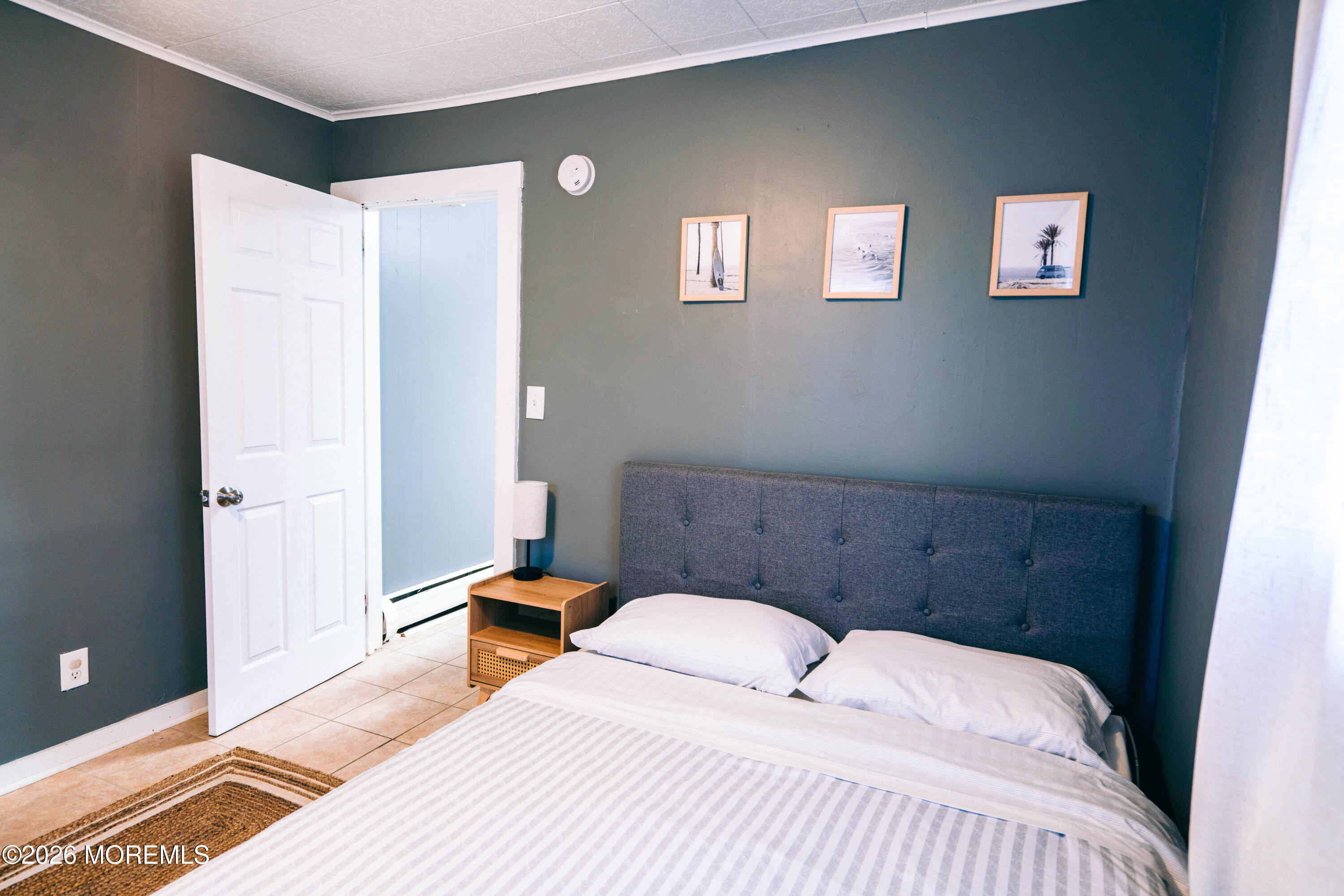 13 Decatur Avenue, Unit C Seaside Park, NJ 08752 - Photo 11 of 35 a bedroom with a bed and a window