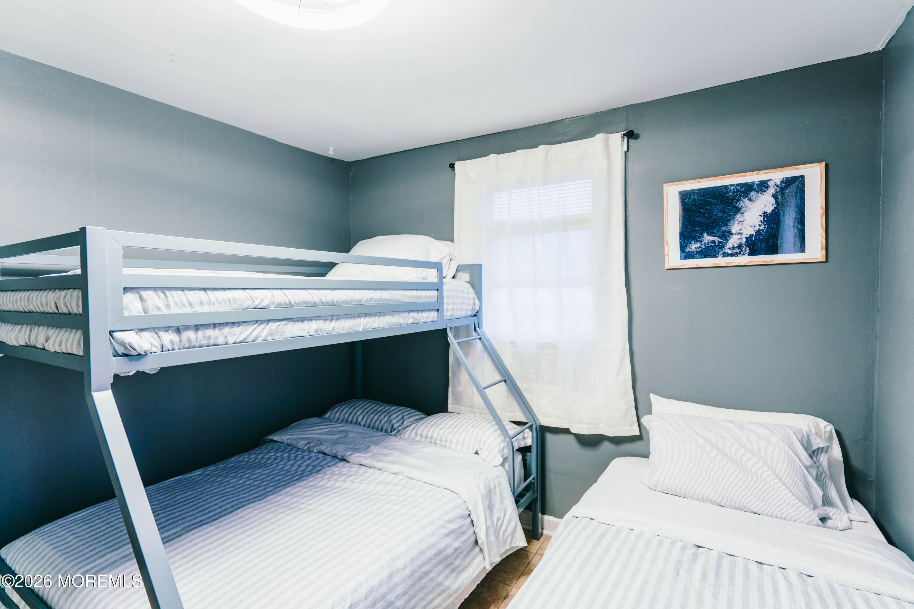 13 Decatur Avenue, Unit C Seaside Park, NJ 08752 - Photo 22 of 35 a bedroom with a bed and a window