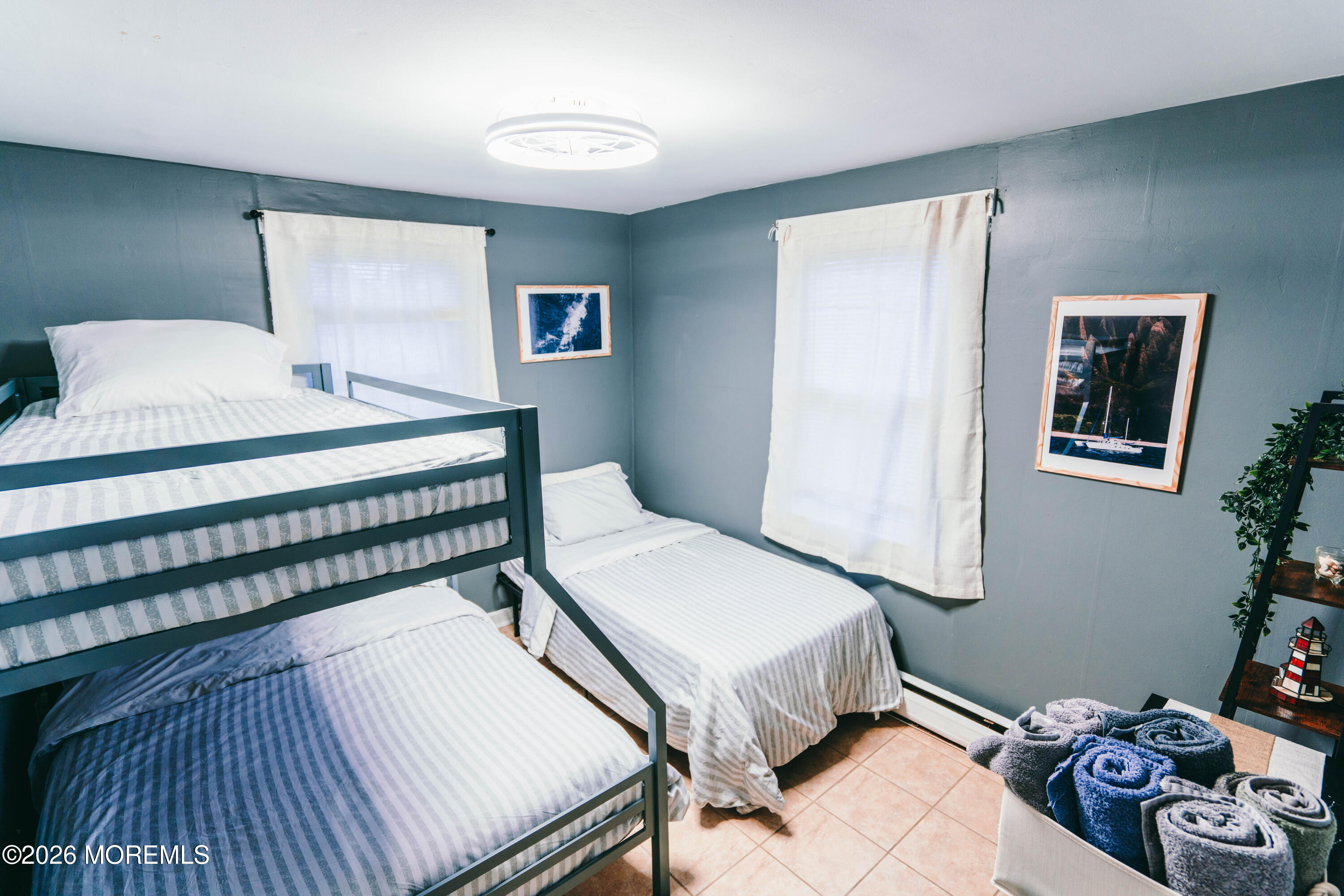 13 Decatur Avenue, Unit C Seaside Park, NJ 08752 - Photo 23 of 35 a bedroom with a bed and a dresser