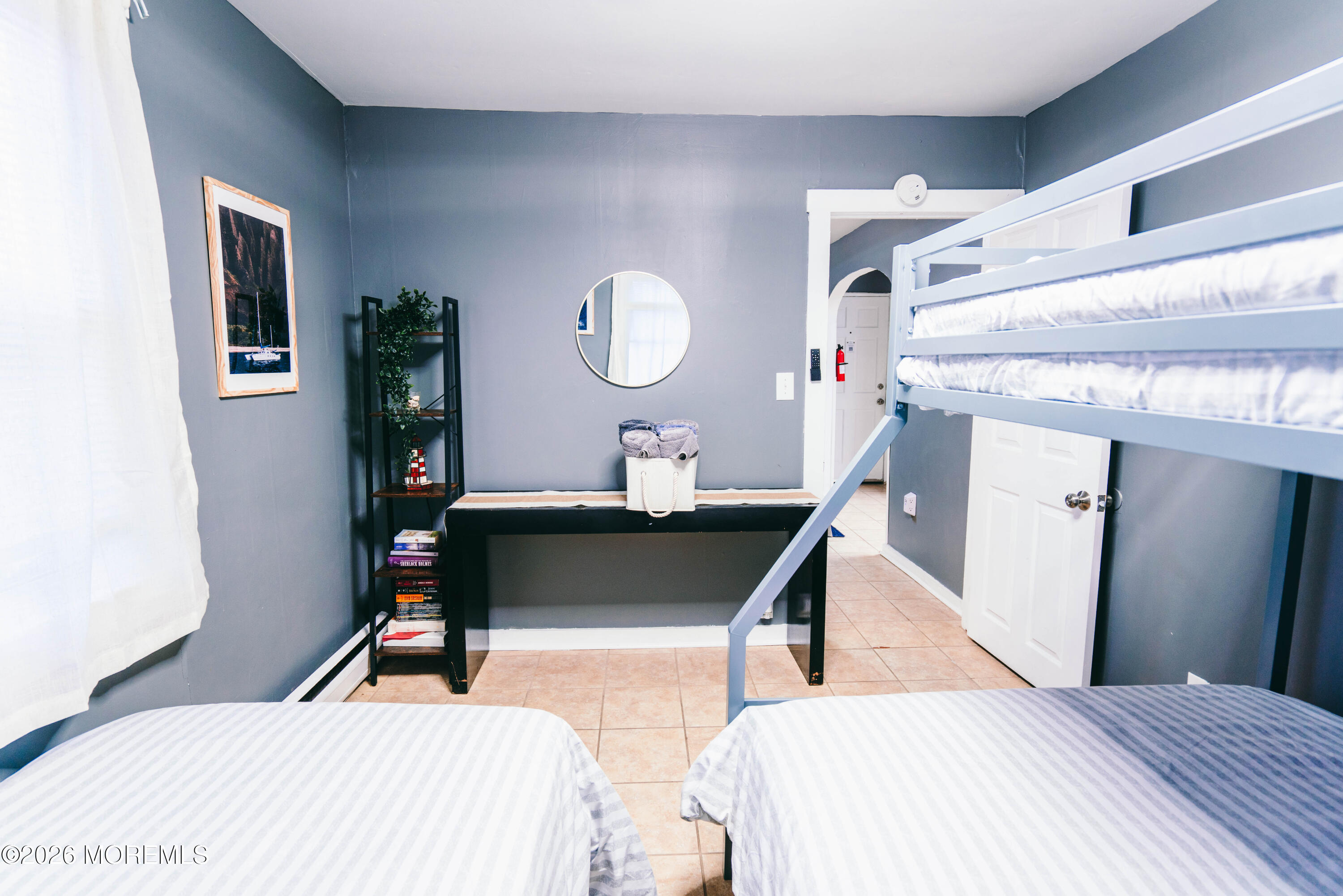13 Decatur Avenue, Unit C Seaside Park, NJ 08752 - Photo 25 of 35 a bedroom with a bed and a table