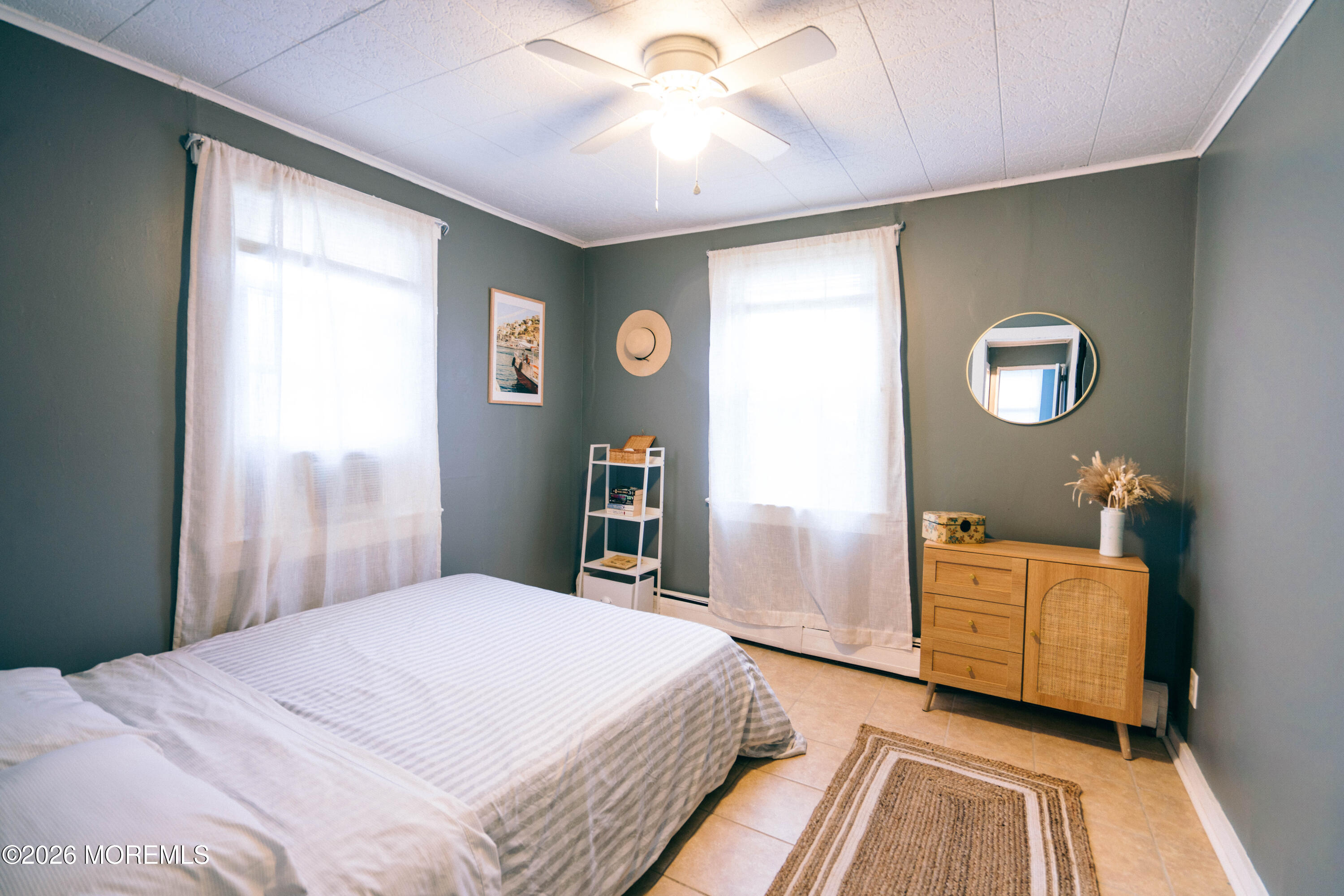 13 Decatur Avenue, Unit C Seaside Park, NJ 08752 - Photo 3 of 35 a bedroom with a bed and a chandelier
