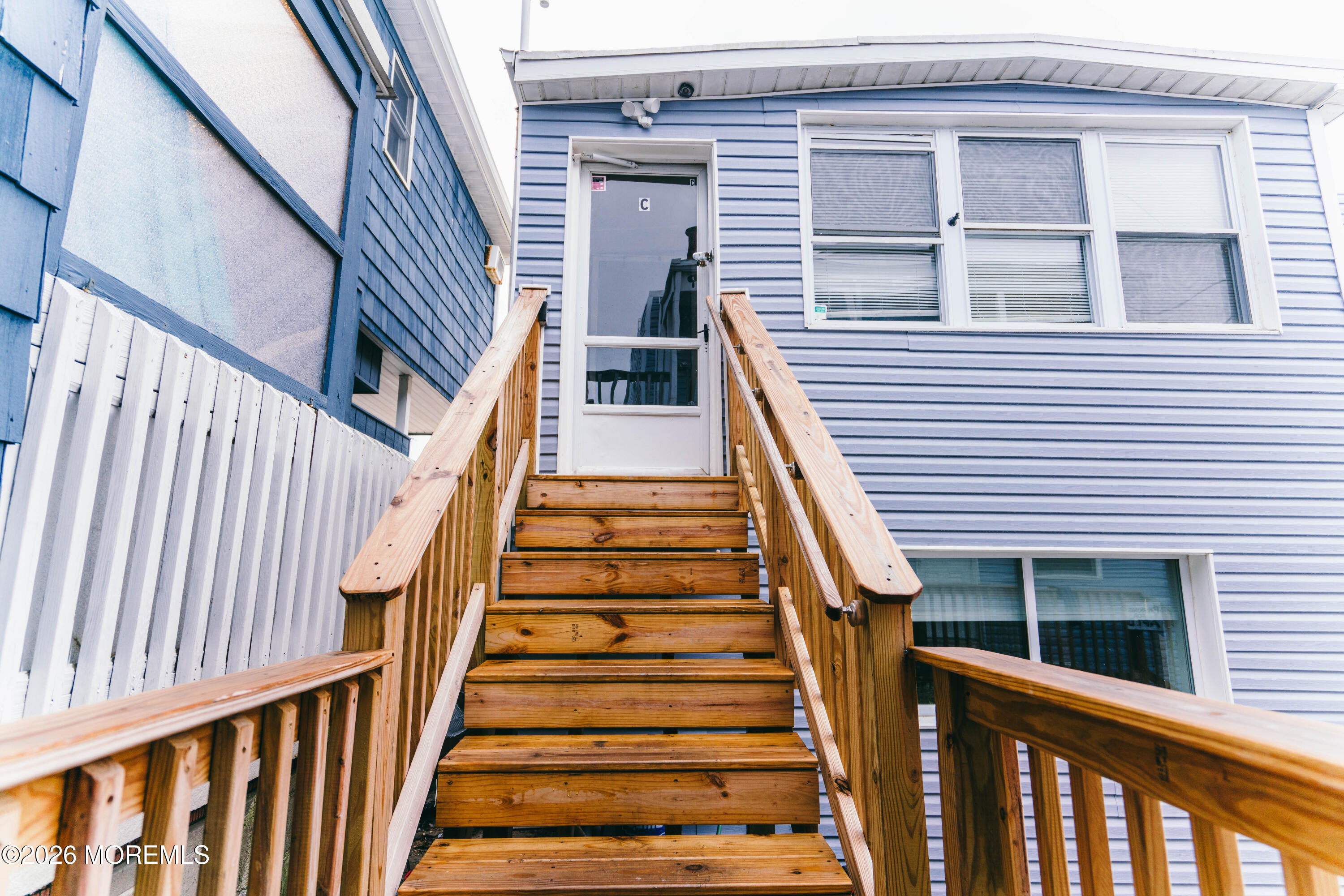 13 Decatur Avenue, Unit C Seaside Park, NJ 08752 - Photo 6 of 35 a view of staircase with wooden floor and white walls