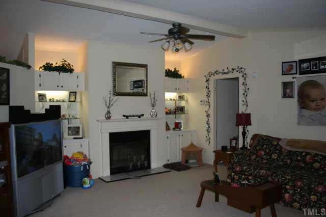 464 Beaver Dam Road Henderson, NC 27537 - Photo 2 of 12 Sapcious living room with fireplace and built-ins on each side