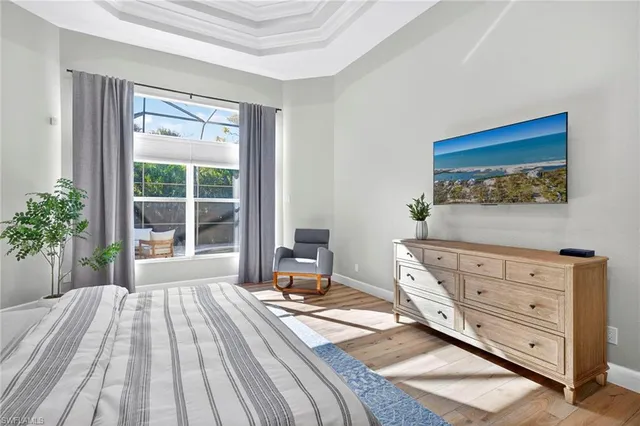 a bedroom with a bed and with furniture