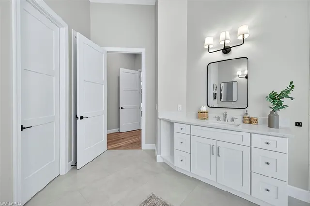 a bathroom with a double vanity sink a mirror and a