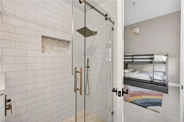a bathroom with a glass shower door
