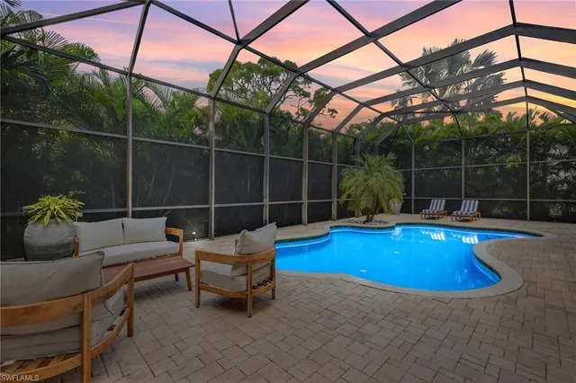 a view of a swimming pool with a patio