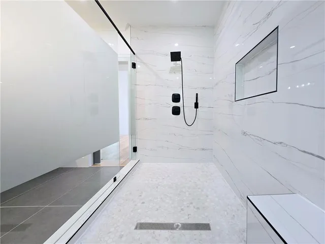 a bathroom with a sink and a large mirror