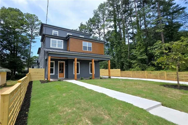 a view of staircase with wooden floor and windows