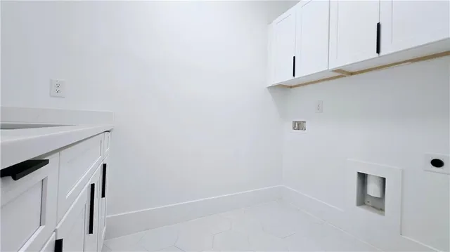 a view of walk in closet with clothes