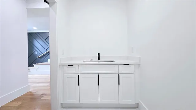 a view of walk in closet with empty racks