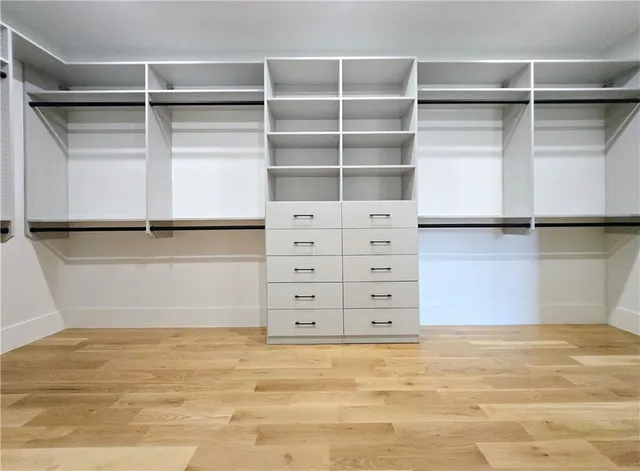 a view of a patio with a table chairs and a backyard