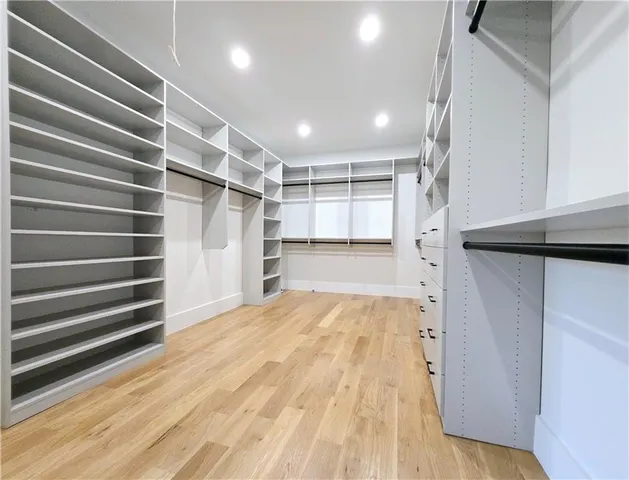 a view of a patio with a table chairs and a backyard