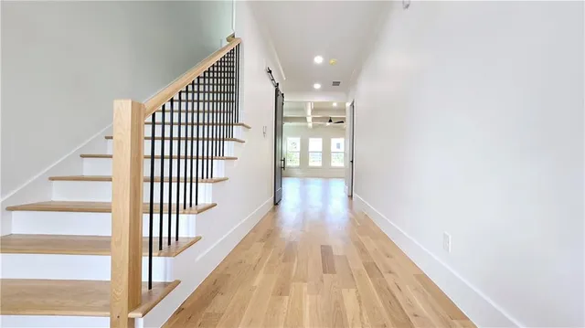 a kitchen with stainless steel appliances granite countertop a stove microwave and sink
