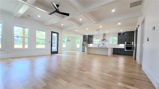 a kitchen with a stove and a window