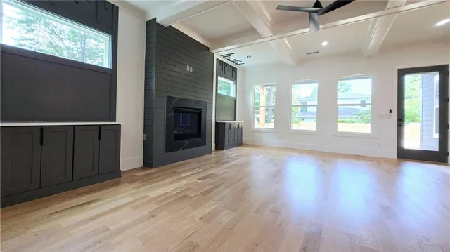 a view of a refrigerator in kitchen and wooden floor