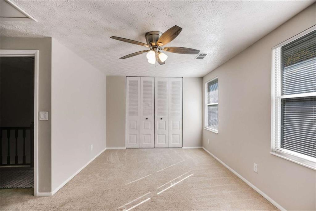 6413 Wedgewood Trace Tucker, GA 30084 - Photo 13 of 30 a view of a livingroom with a ceiling fan and window