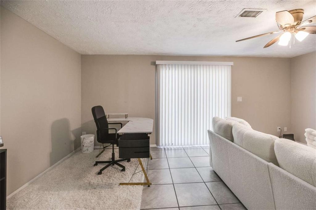 6413 Wedgewood Trace Tucker, GA 30084 - Photo 19 of 30 a work room with furniture and a window