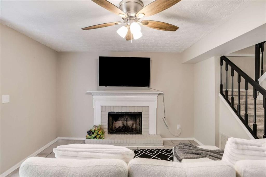 6413 Wedgewood Trace Tucker, GA 30084 - Photo 20 of 30 a living room with furniture and a fireplace