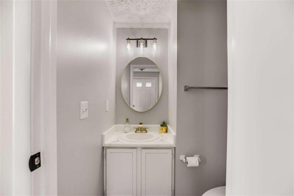 6413 Wedgewood Trace Tucker, GA 30084 - Photo 26 of 30 a bathroom with a sink and a mirror