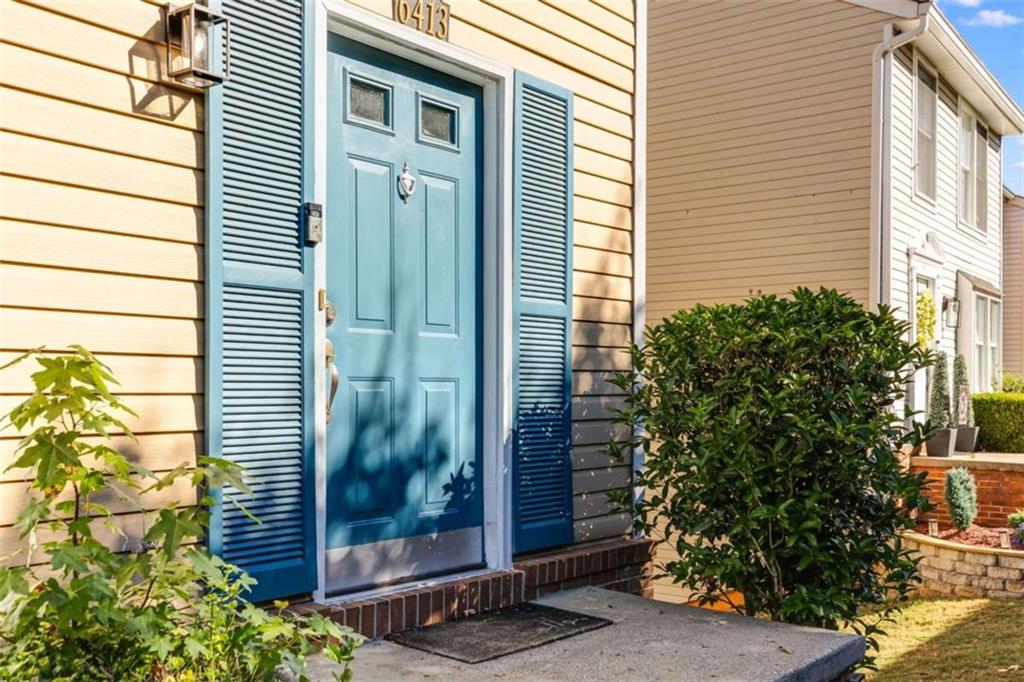6413 Wedgewood Trace Tucker, GA 30084 - Photo 3 of 30 a view of a door and chair and potted plant