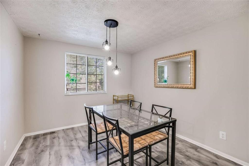 6413 Wedgewood Trace Tucker, GA 30084 - Photo 8 of 30 a dining room with furniture and window