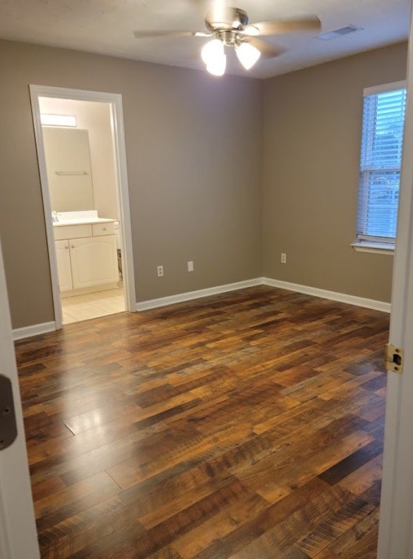 2006 Cody Drive Lebanon, TN 37087 - Photo 12 of 18 an empty room with wooden floor cabinet and windows