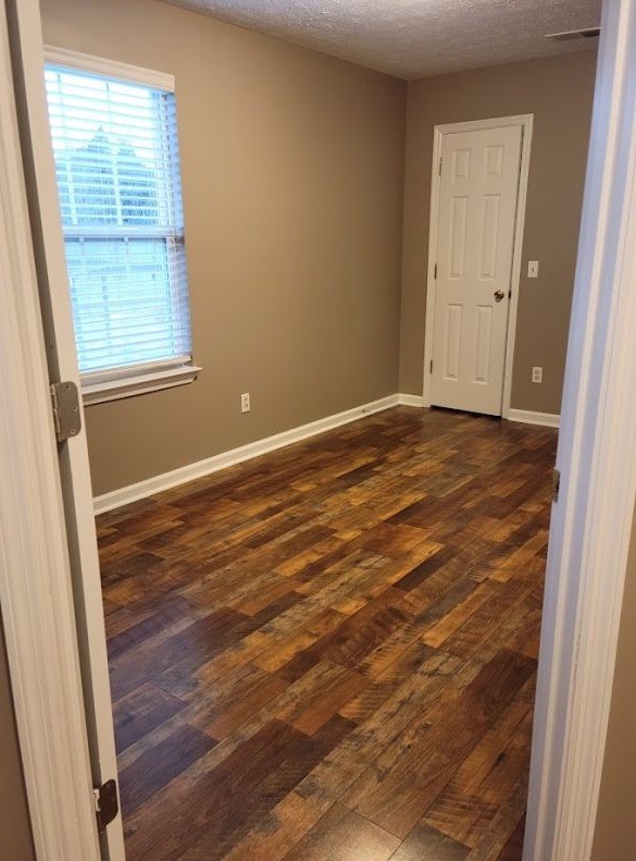 2006 Cody Drive Lebanon, TN 37087 - Photo 16 of 18 an empty room with wooden floor and windows