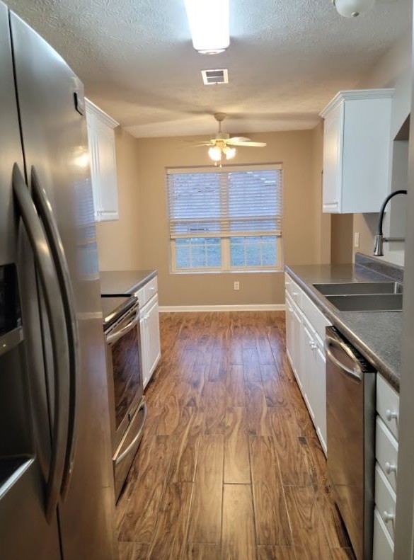 2006 Cody Drive Lebanon, TN 37087 - Photo 3 of 18 a kitchen with stainless steel appliances granite countertop a refrigerator a sink and wooden floor