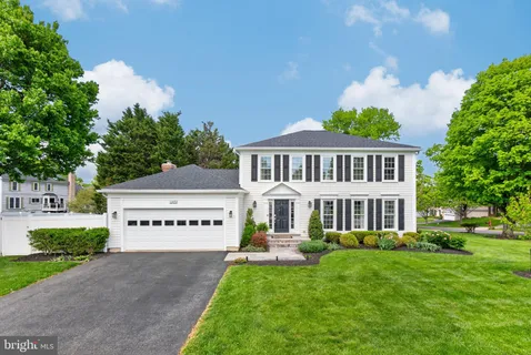 a view of a house with a garden and deck