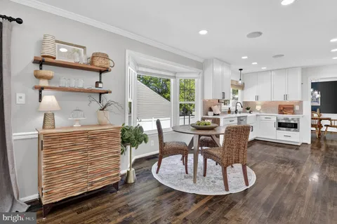 a kitchen with stainless steel appliances a refrigerator stove and microwave