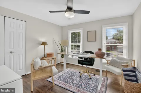 a bedroom with furniture and wooden floor