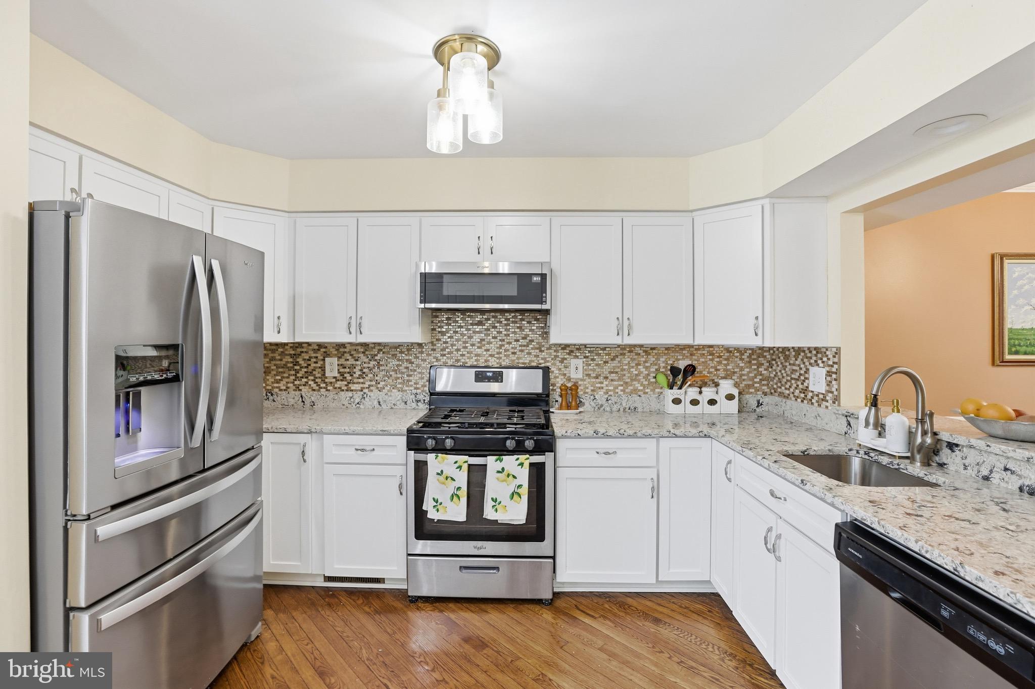 3045 Button Bush Lane Laurel, MD 20724 - Photo 16 of 28 a kitchen with a refrigerator stove and sink