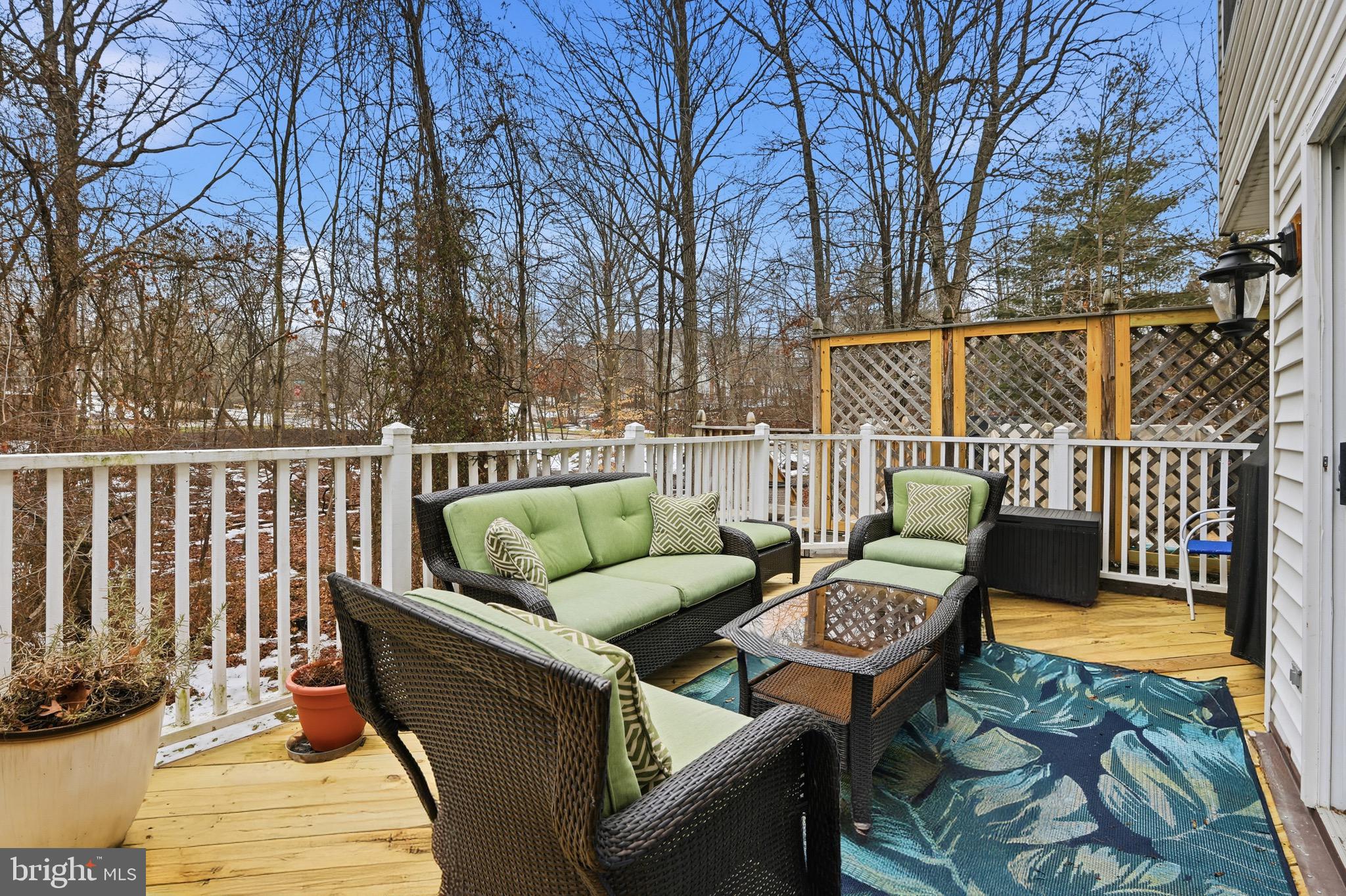 3045 Button Bush Lane Laurel, MD 20724 - Photo 17 of 28 a roof deck with couches and wooden fence