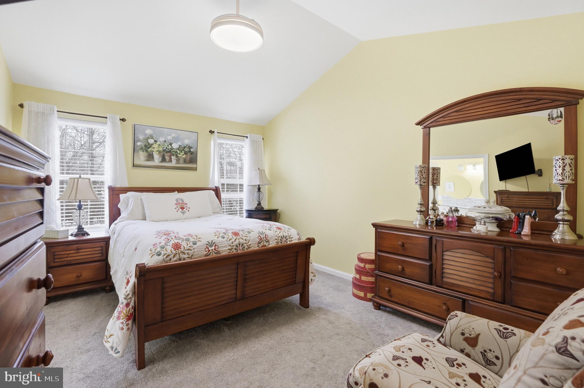 3045 Button Bush Lane Laurel, MD 20724 - Photo 19 of 28 a bedroom with a bed and a flat screen tv