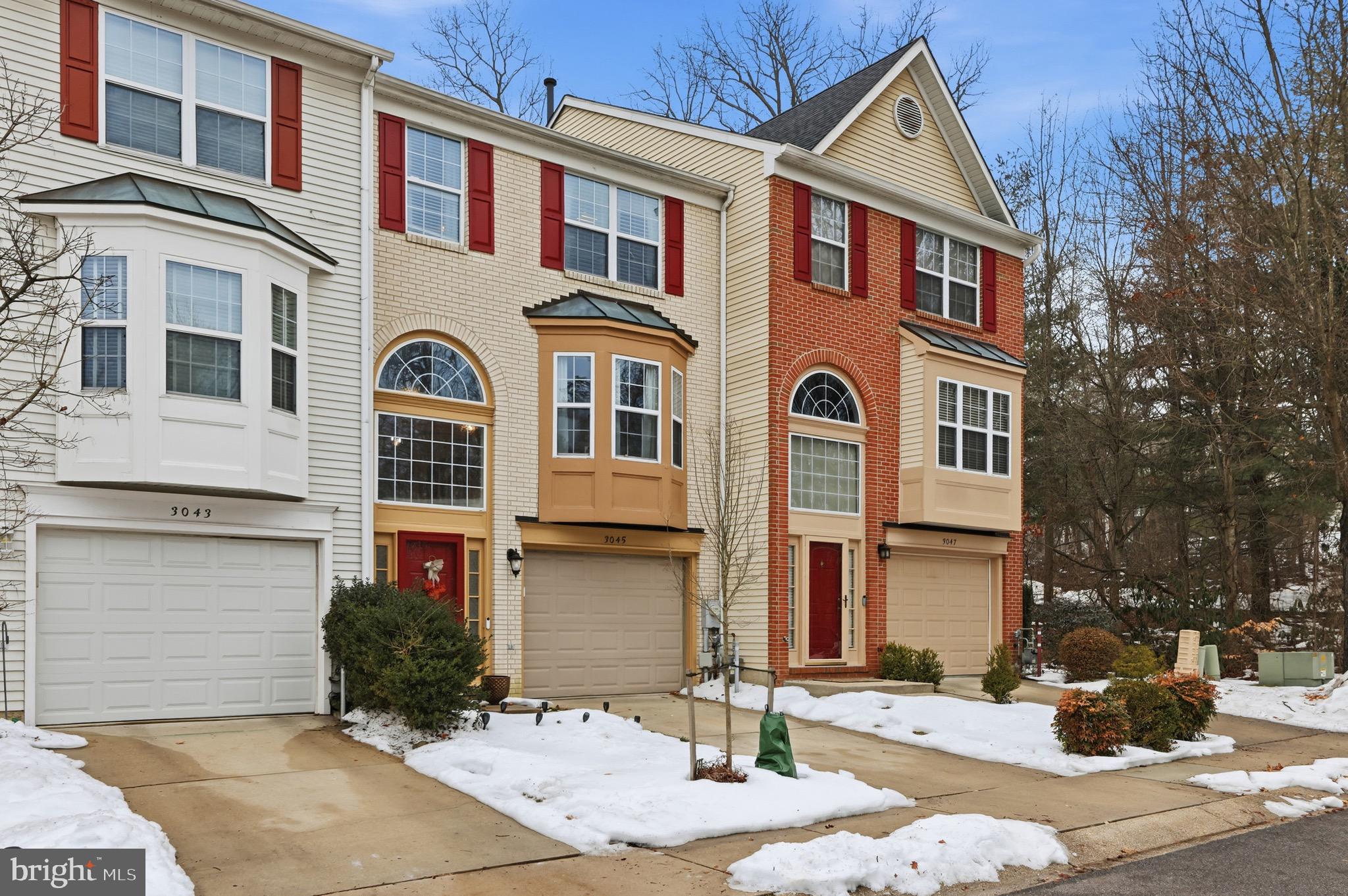 3045 Button Bush Lane Laurel, MD 20724 - Photo 2 of 28 a front view of a building with a yard