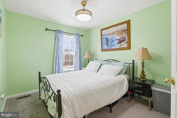 a bedroom with a bed and a table