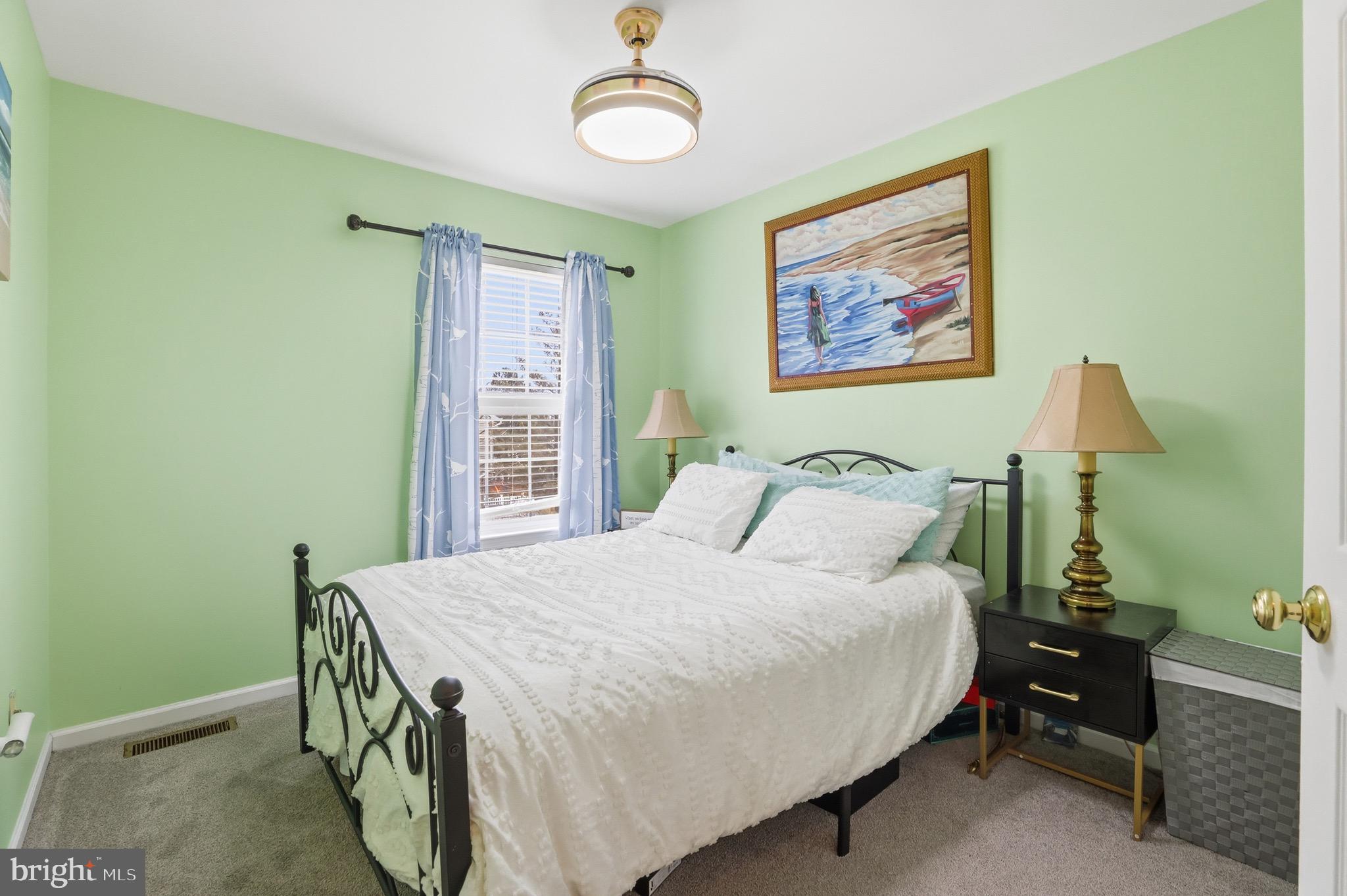 3045 Button Bush Lane Laurel, MD 20724 - Photo 25 of 28 a bedroom with a bed and a table