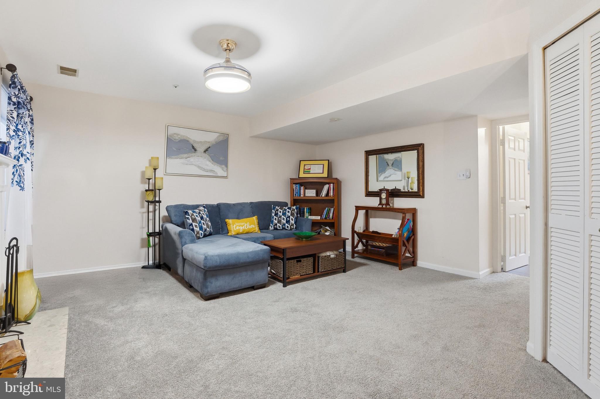 3045 Button Bush Lane Laurel, MD 20724 - Photo 8 of 28 a living room with furniture and a flat screen tv