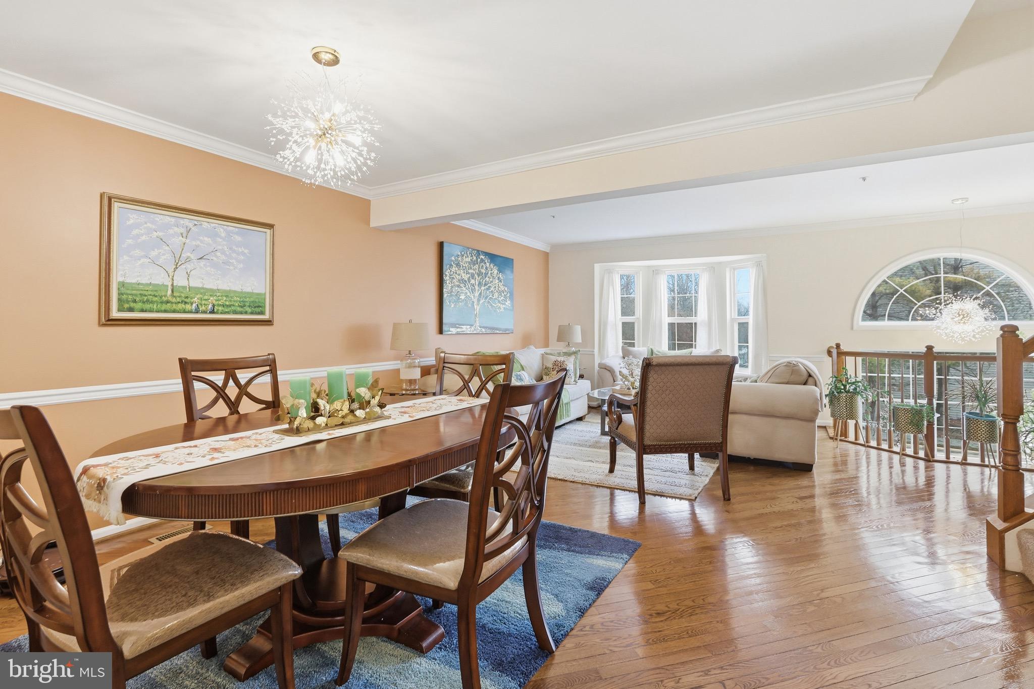 3045 Button Bush Lane Laurel, MD 20724 - Photo 9 of 28 a view of a dining room with furniture wooden floor and chandelier