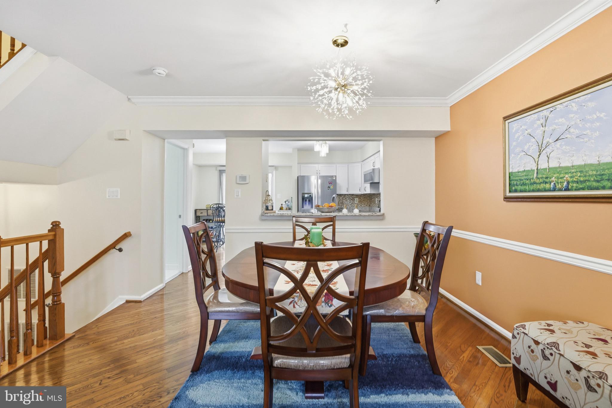 3045 Button Bush Lane Laurel, MD 20724 - Photo 10 of 28 a view of a dining room with furniture and wooden floor