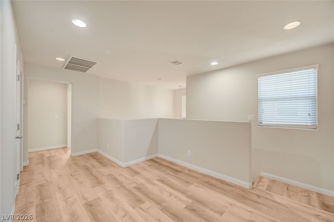 113 Elm Reed Avenue Las Vegas, NV 89113 - Photo 28 of 62 Unfurnished room featuring recessed lighting and light wood-style flooring